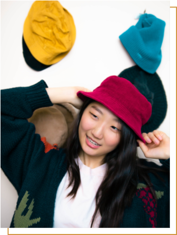 Girl with colorful hats