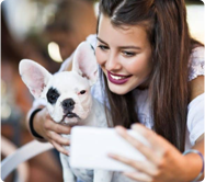 girl_holds_dog_with_one_black_eye